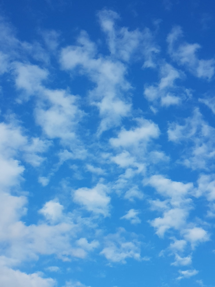 Image-of-blue-sky-with-white-fluffy-clouds